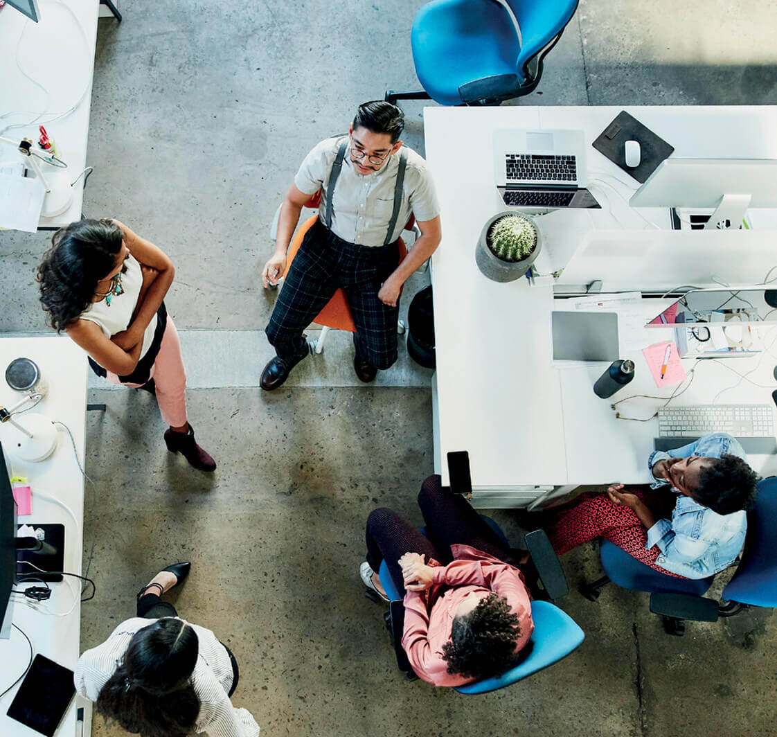 People sitting in a modern office viewed from above.