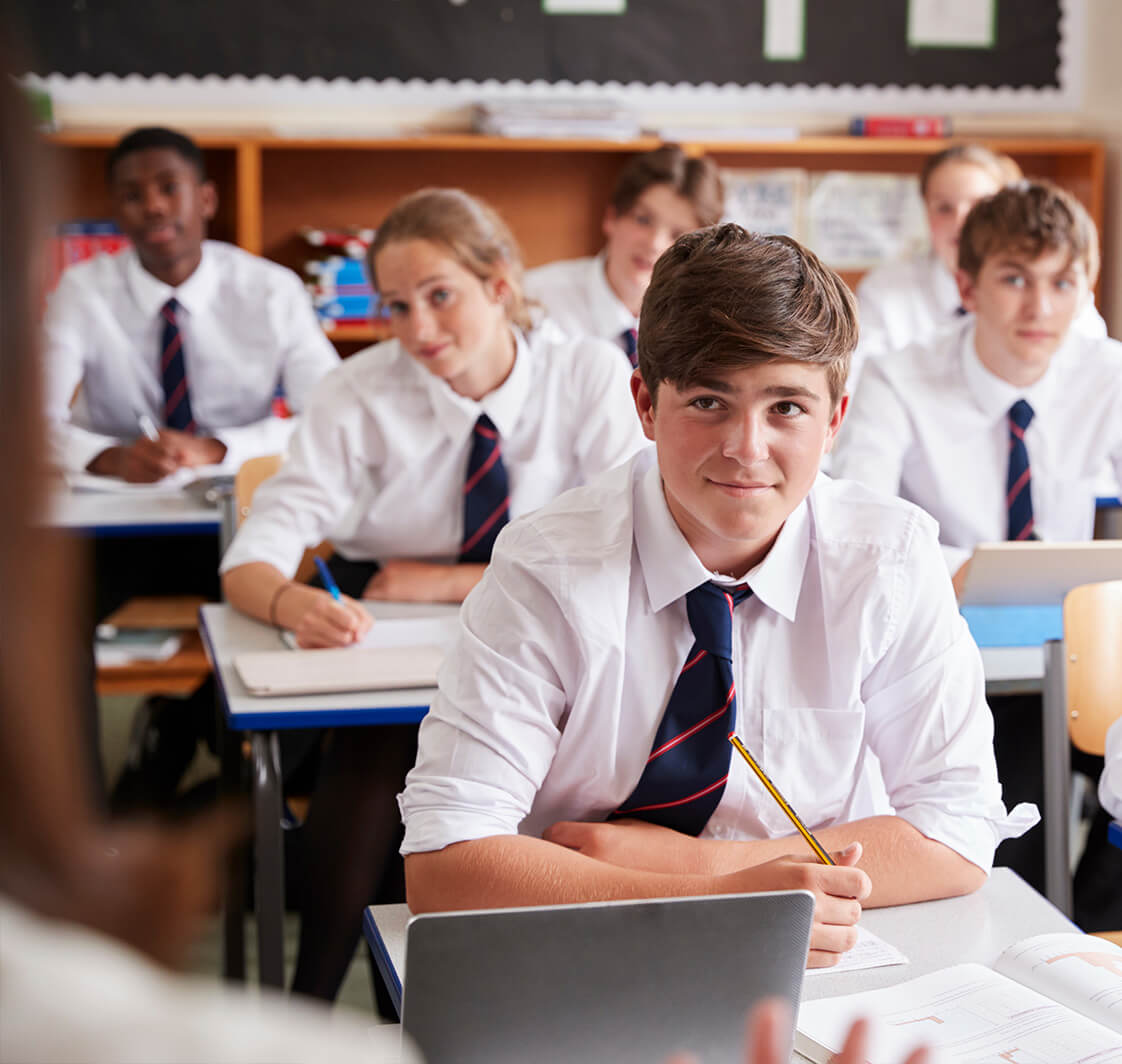 Pupils using computers in a classoom.