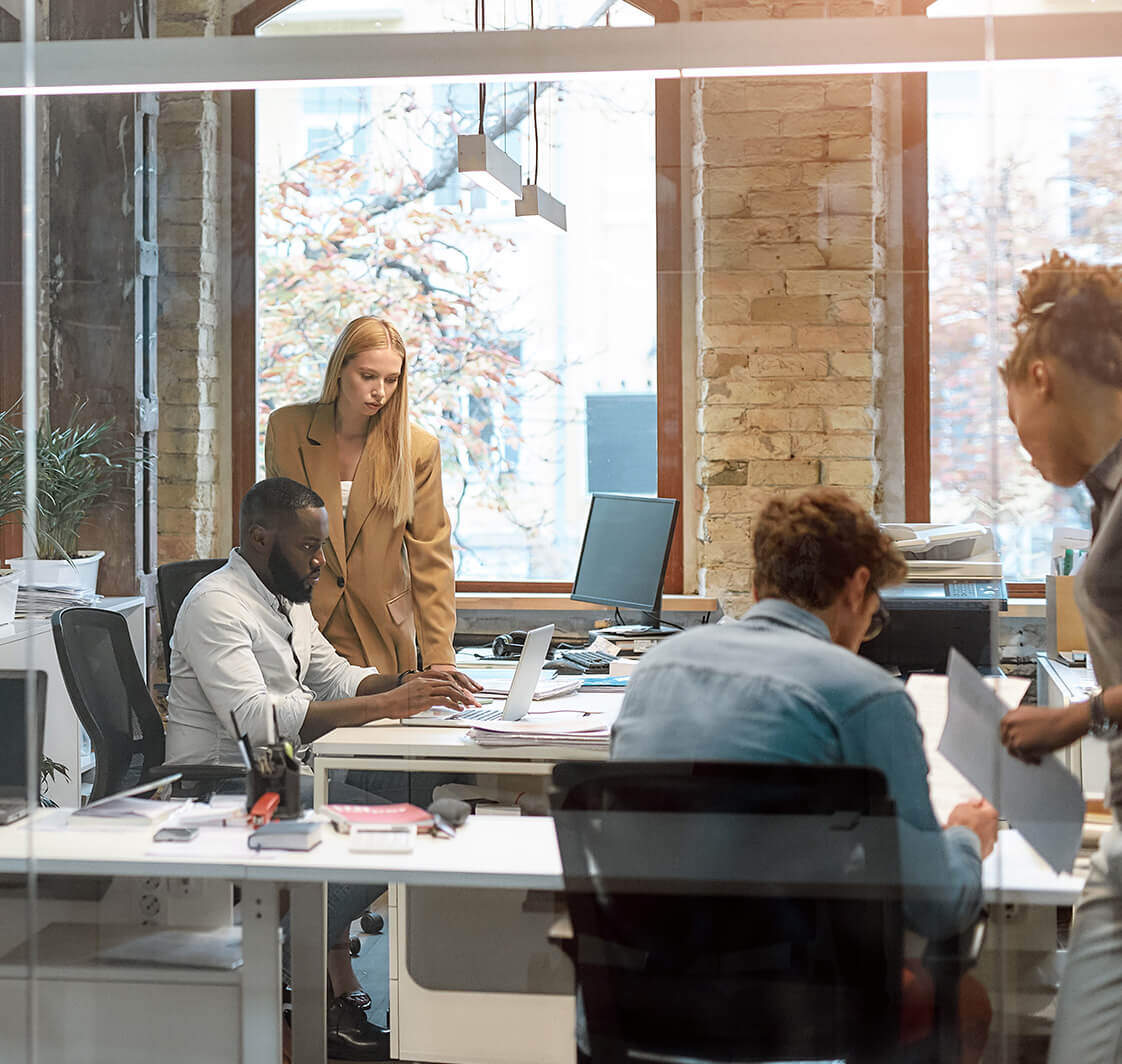 Group of young business people working together in the creative office.