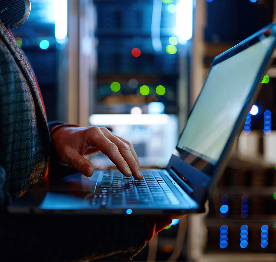 IT technician checking a laptop.