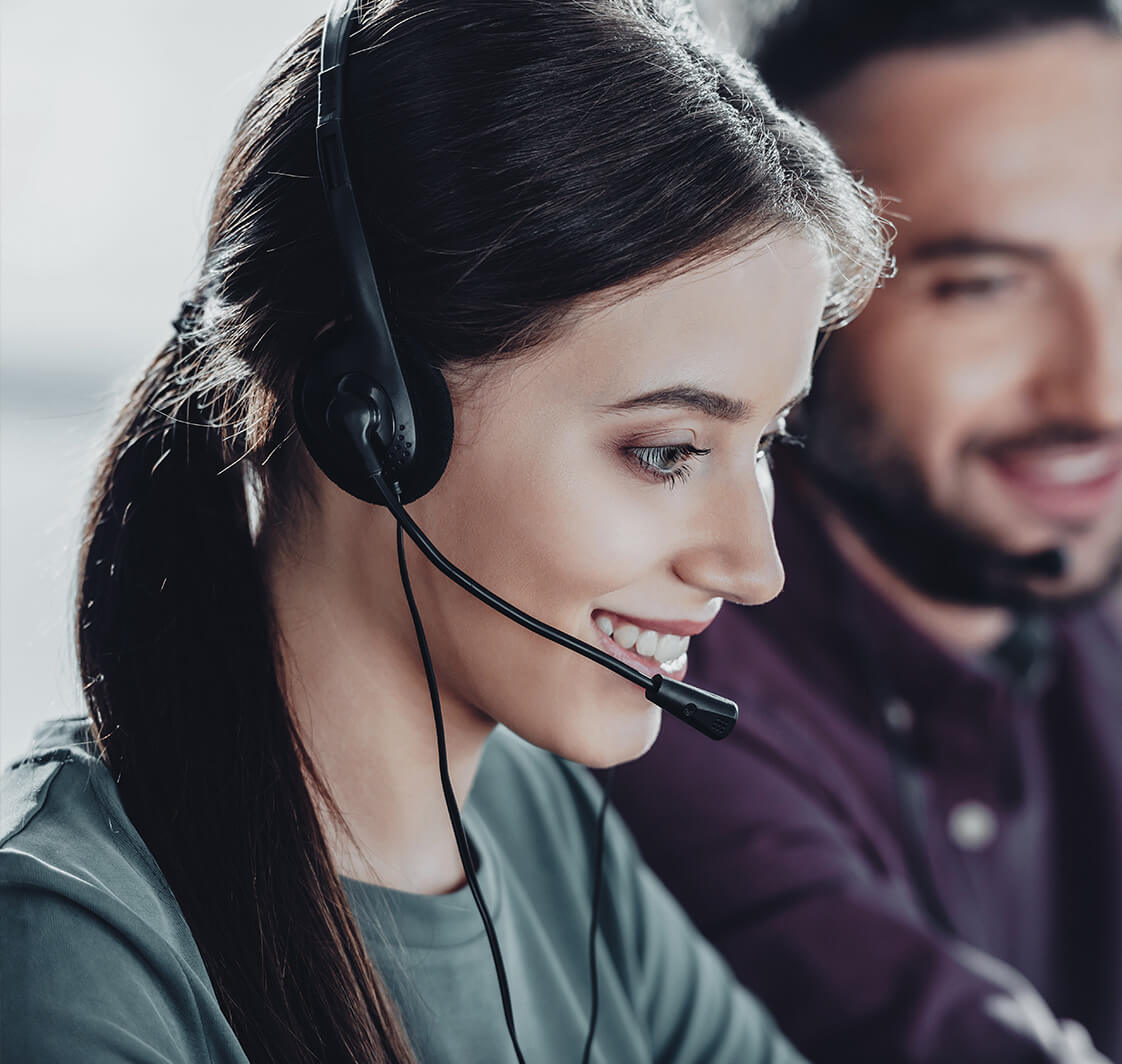 Happy team of call centre managers working together at modern office.