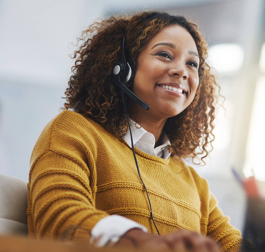 African woman, call center agent or smile with voip for consulting, listening or contact us in office. Female consultant, customer service or tech support crm with headphones, microphone or help desk.