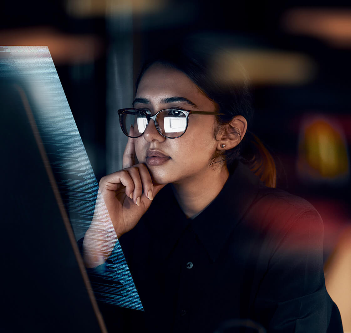 Woman looking at data on a computer screen.