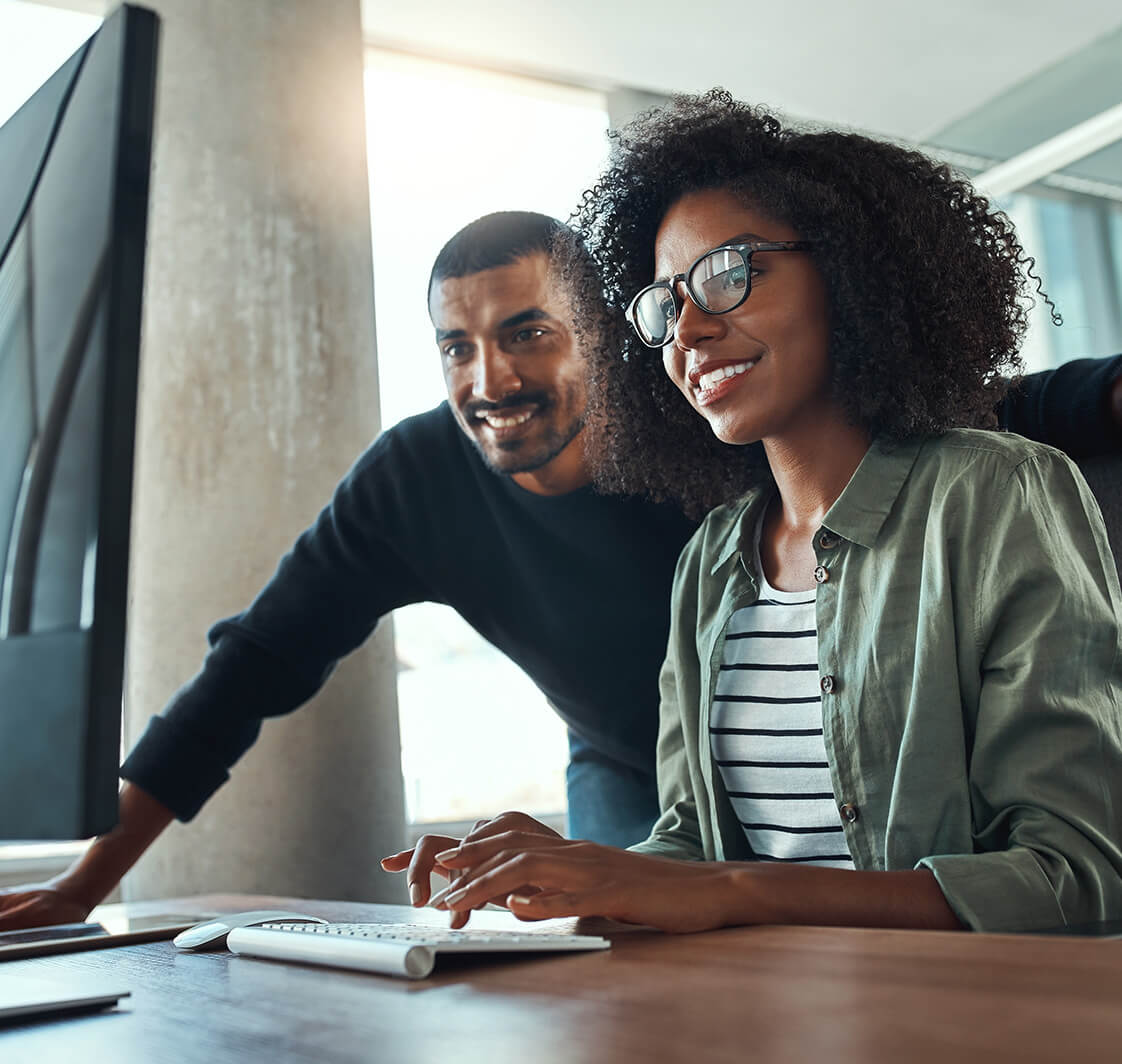 Two professional business people working together in office.