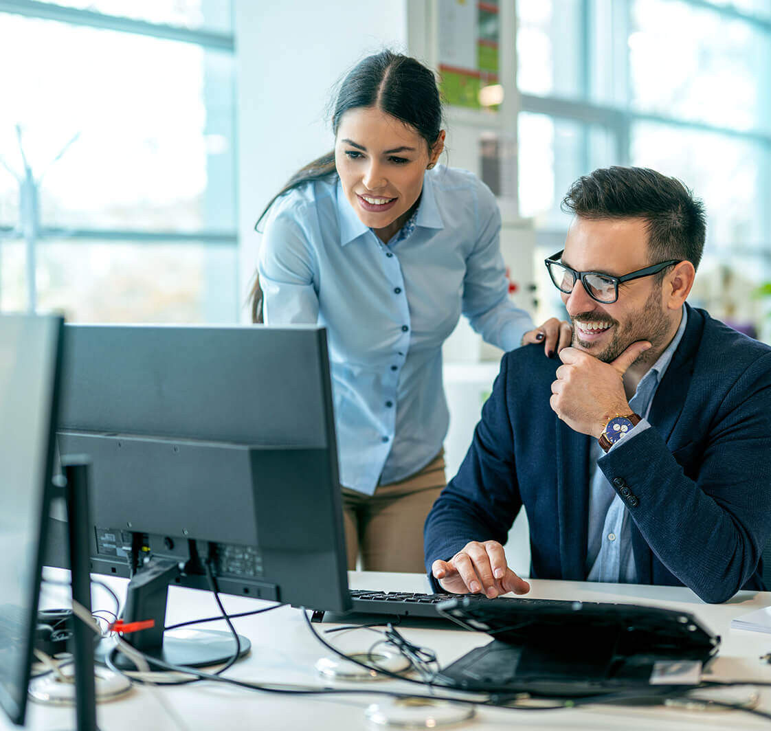 Discussing online project with employee in the office.