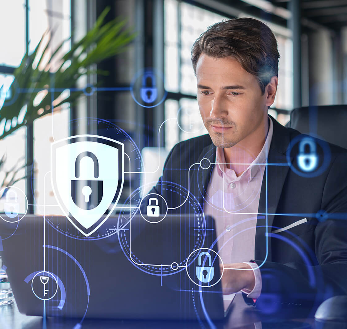 Businessman in suit at workplace working with laptop to defend customer cyber security. Concept of clients information protection and brainstorm. Padlock hologram over office background. 